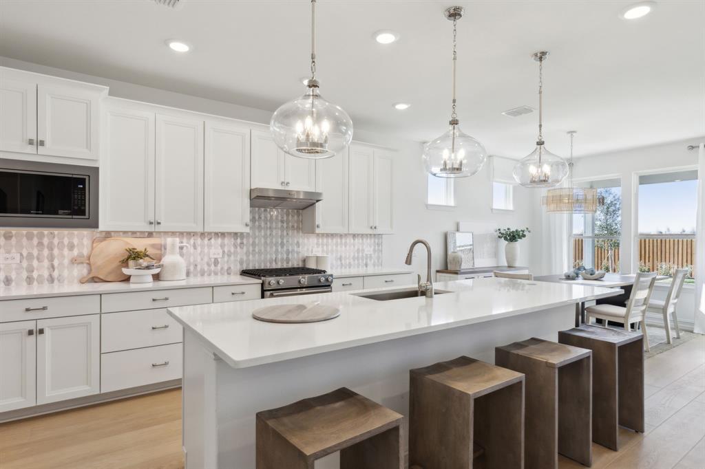 *Model Representation - Spacious kitchen with eat-in bartop island *Model Representation - Spacious kitchen with eat-in bartop island
