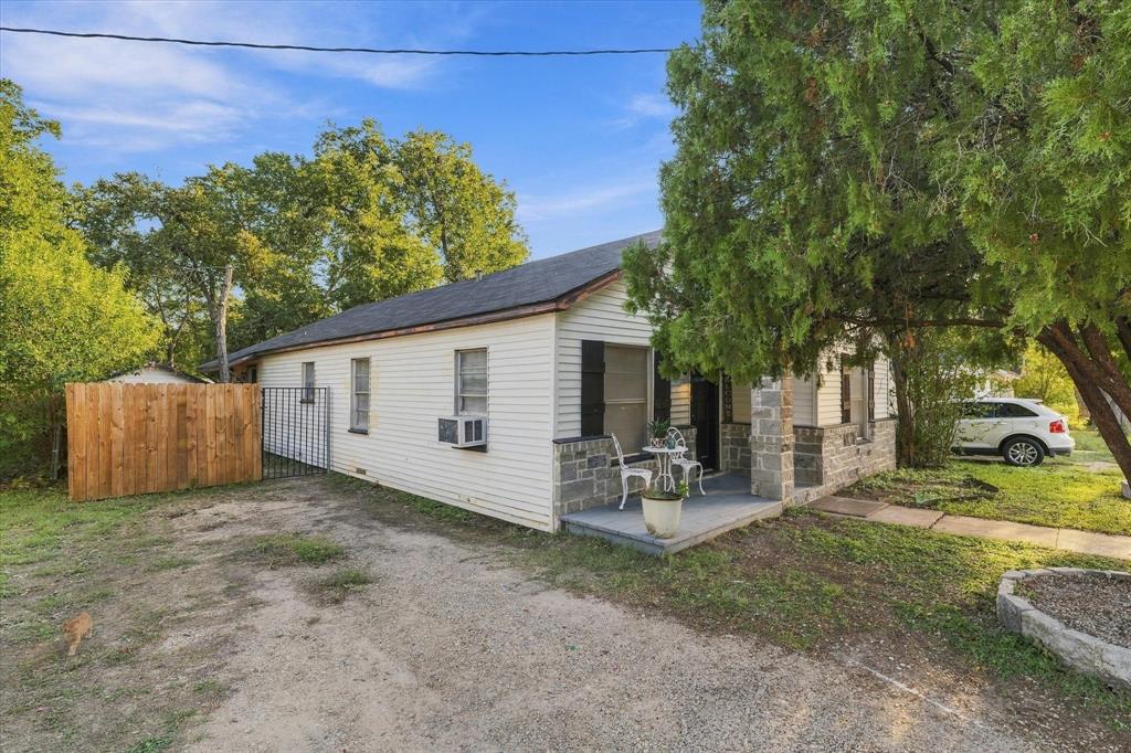 Side view of exterior with driveway and gate Side view of exterior with driveway and gate