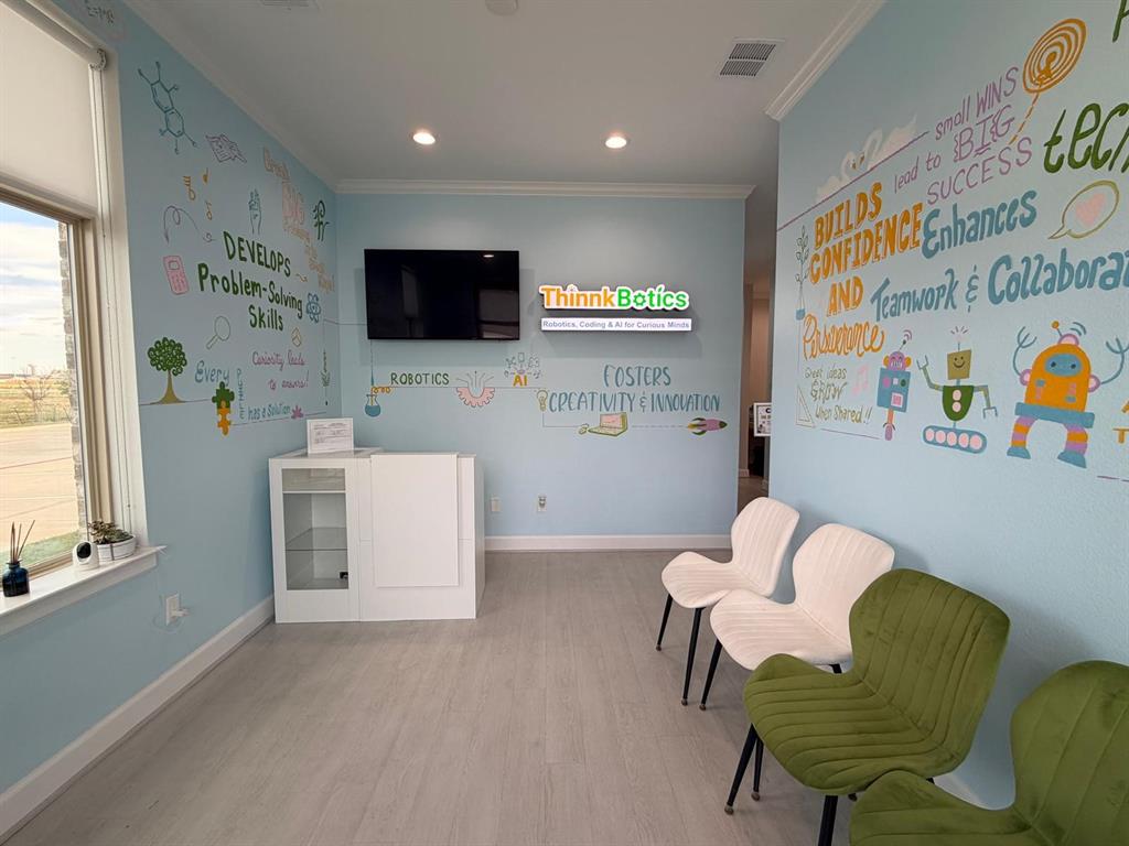 Interior space featuring wood-finish flooring, recessed lighting, and a white built-in cabinet