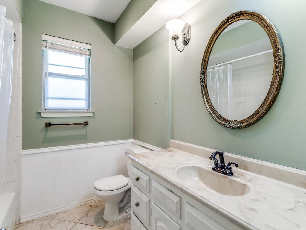 Full bathroom with toilet and vanity