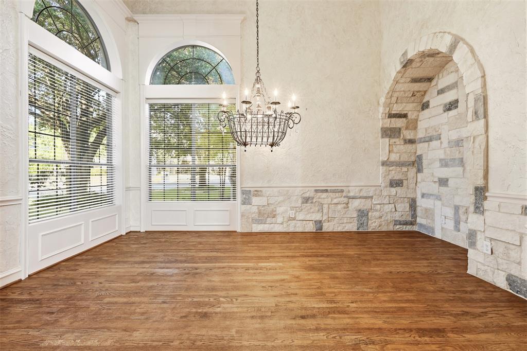 Hand scraped wood floors and custom stone enhancements