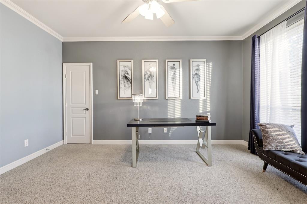 Crown molding, ceiling fan, white trim, light-colored carpeting, and a window with blinds