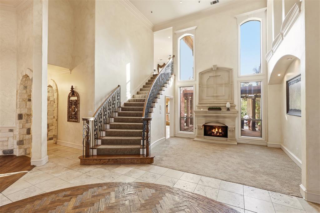 Formal entry and sitting area with cast stone gas fireplace