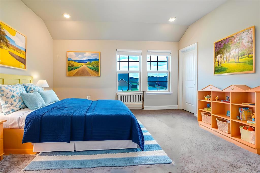 Bedroom featuring lofted ceiling, carpet flooring, recessed lighting, and radiator