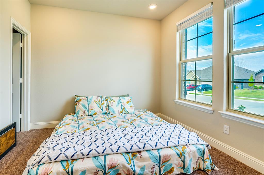 Carpeted bedroom featuring baseboards and recessed lighting