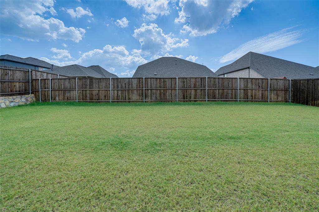 View of fenced backyard