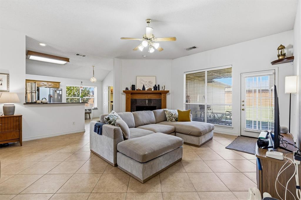 The open concept living room with access to the backyard