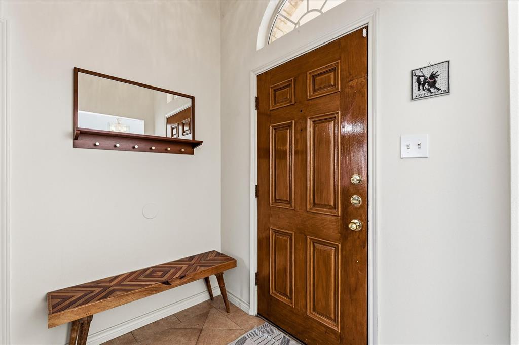 Well lit front entry way with coat closet and open to the dining room