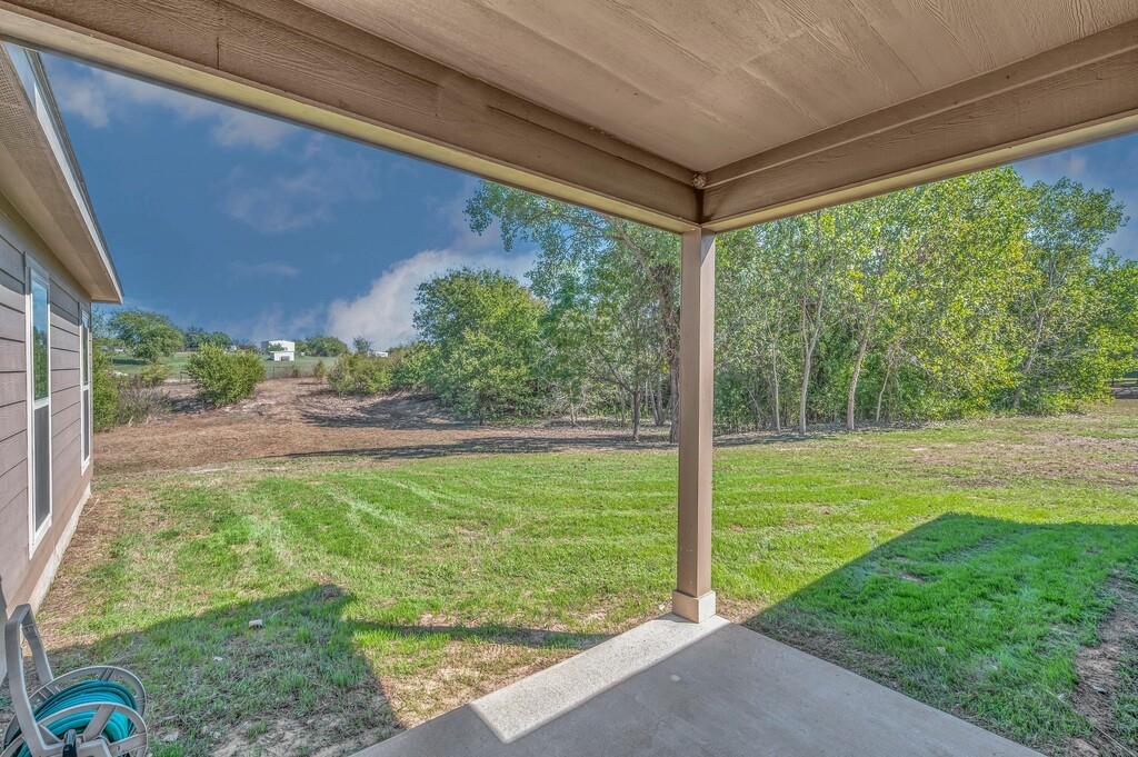 Back covered patio and backyard