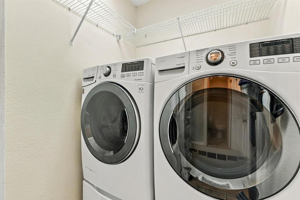 Laundry room supports side by side washer and dryer.