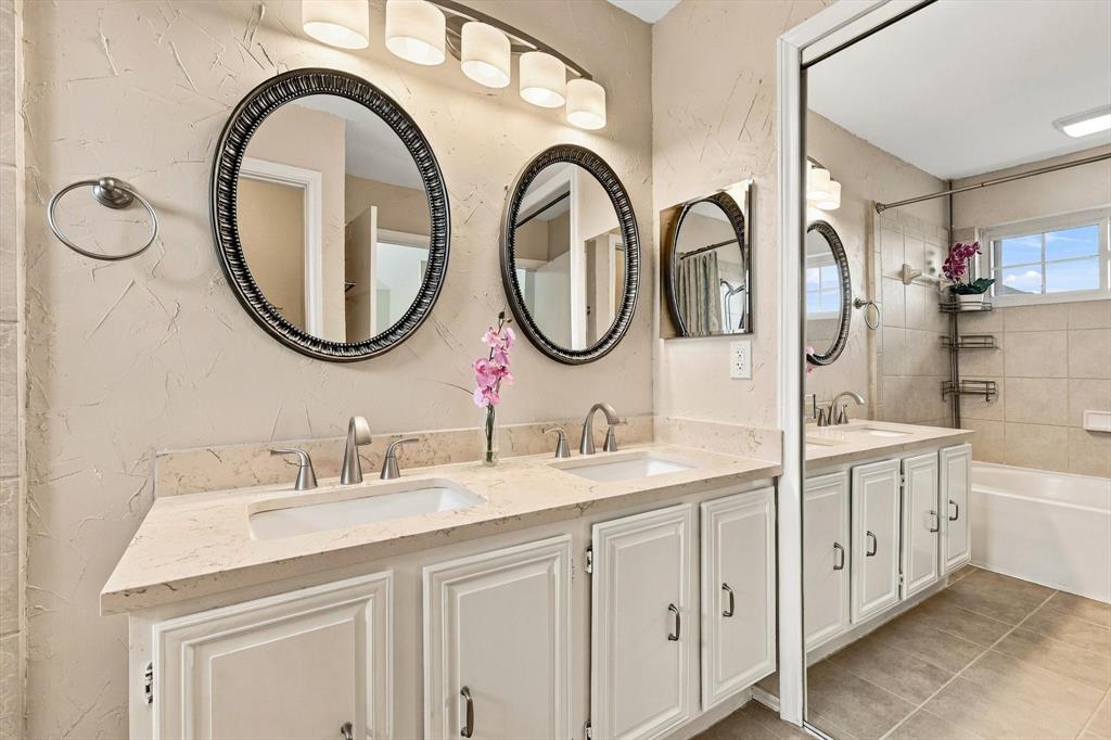 Primary bathroom features dual-sink vanity
