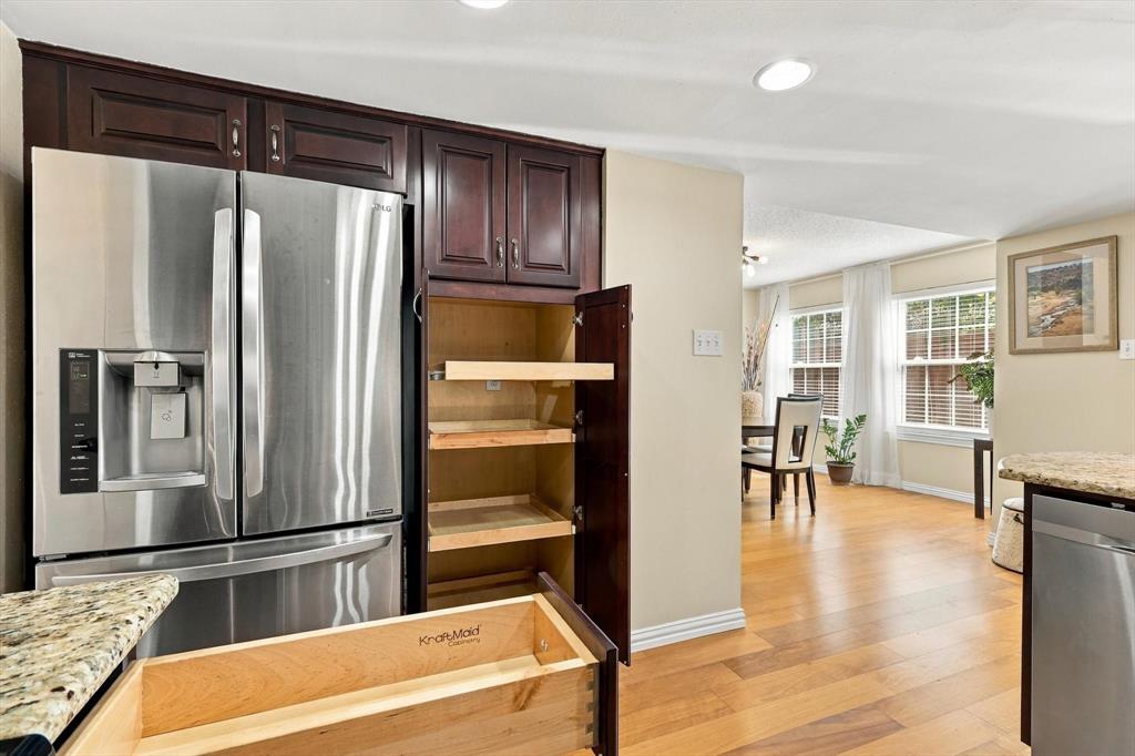 Kraftmaid cabinets feature pull out shelves and corner lazy Susan.
