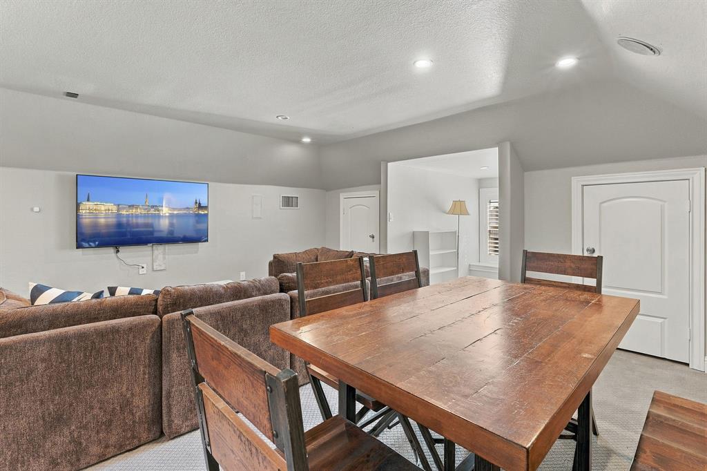 Vaulted ceilings, recessed lighting, and multi-panel interior doors