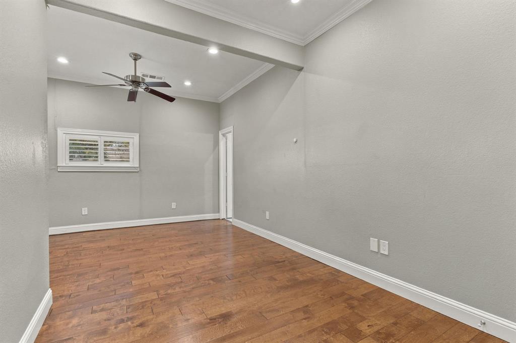 Room featuring wood-finish flooring, recessed lighting, crown molding, and a ceiling fan