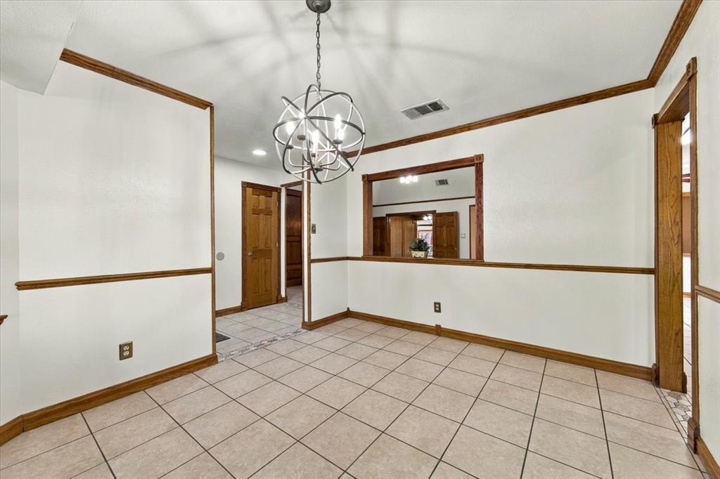 Formal dining room with a bay window facing the street - opening to the kitchen Formal dining room with a bay window facing the street - opening to the kitchen