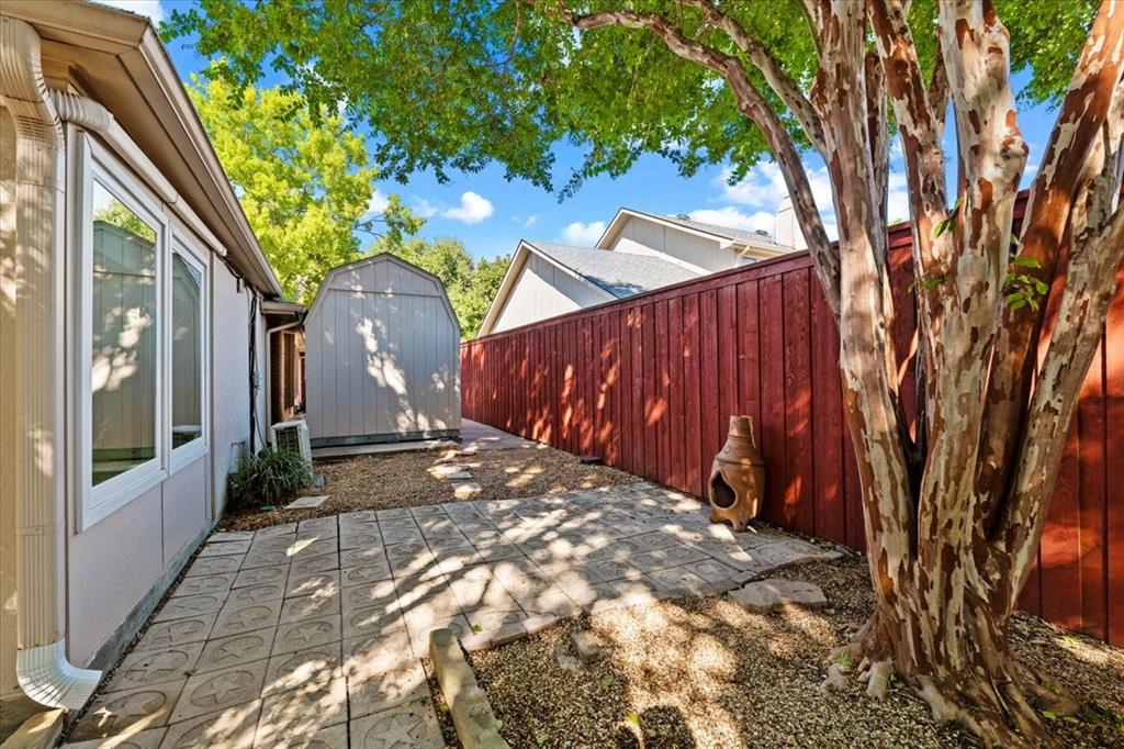 more pavers = low maintenance east yard - storage shed is  8 x 14 ft