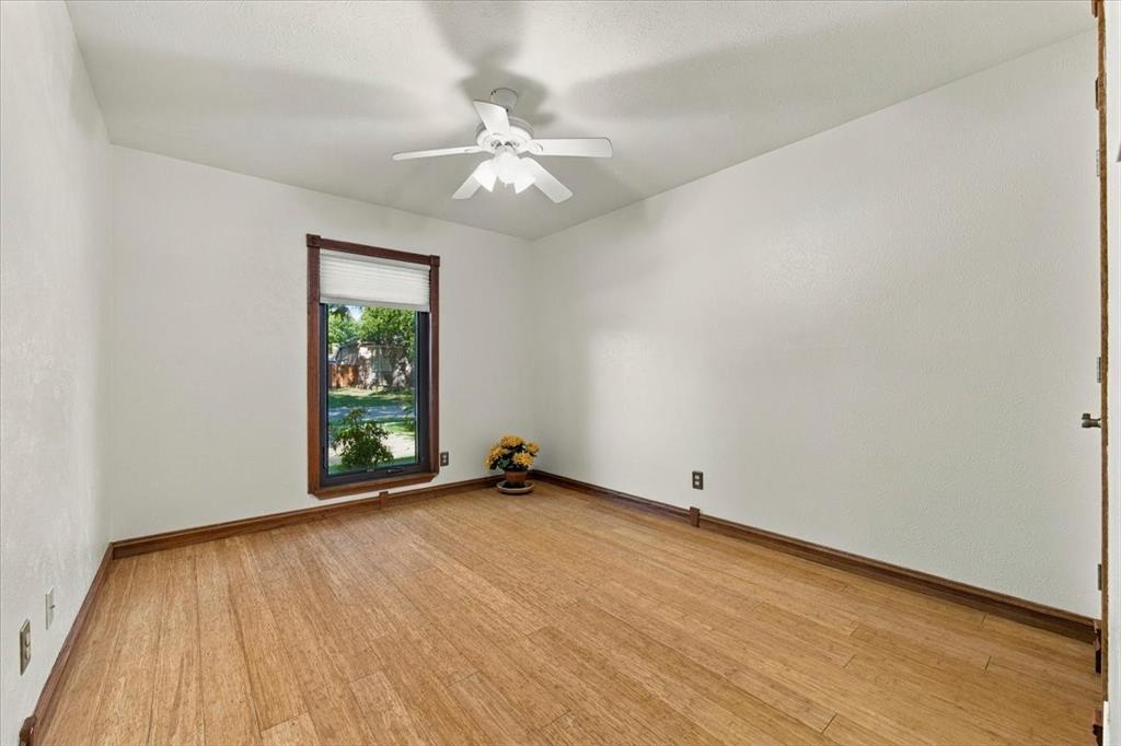 This is the larger of the 2 front bedrooms - bamboo flooring - ceiling fan - full bath across the hall - privacy shades