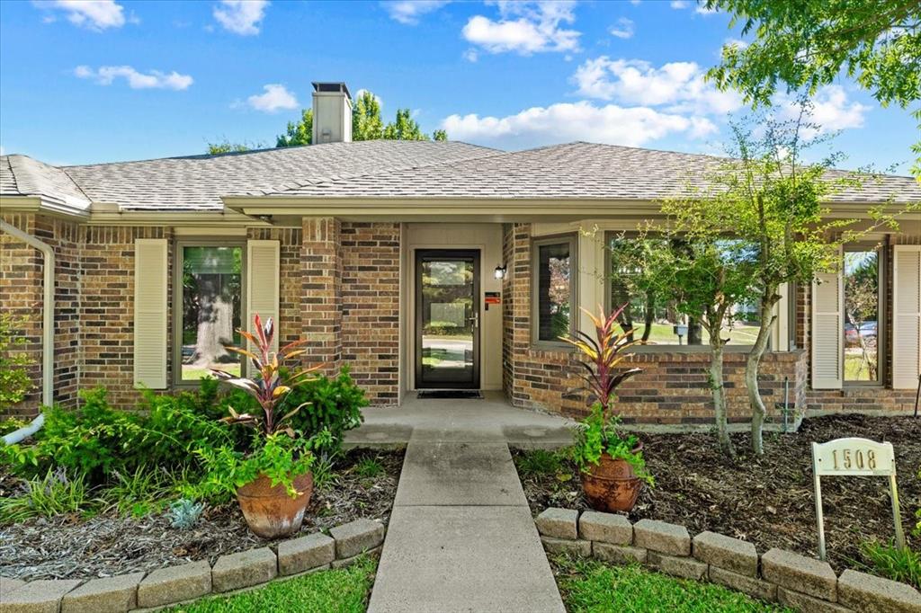Front porch and beautiful entry with storm door and designer door