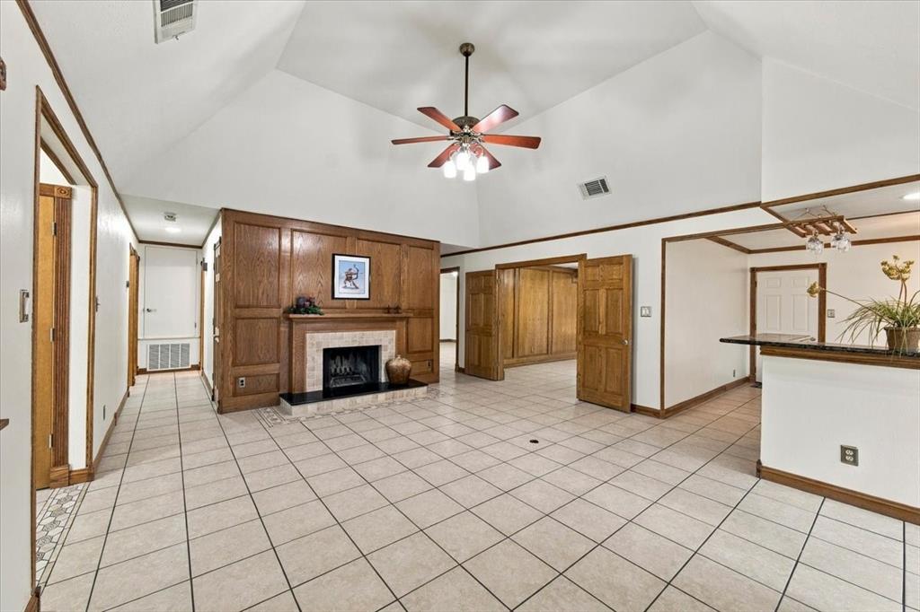 Large living room  - Dover White, Sherwin Williams painted walls throughout - rich oak trim around windows including crown moldings and doors