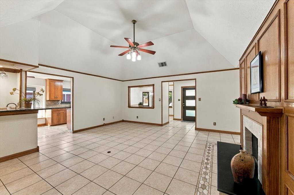 Formal living room viewing front entry and opening to the formal dining room - also view to the kitchen Formal living room viewing front entry and opening to the formal dining room - also view to the kitchen