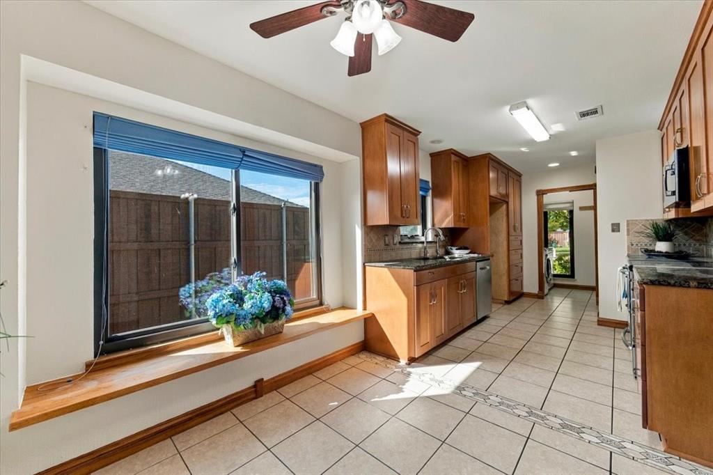 Seating bench and window to the enclosed yard - designer shades - far opening is to the enclosed utility room with a pocket door