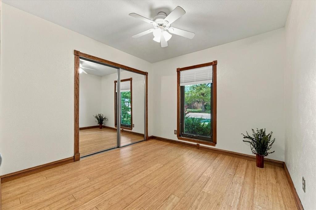 The closet has shelving - glass doors - privacy shades - ceiling fan - bamboo flooring - fresh pained walls -