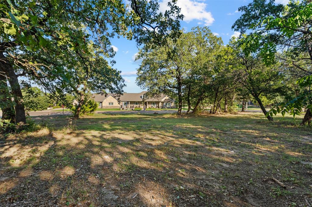 Expansive lot featuring mature hardwood trees