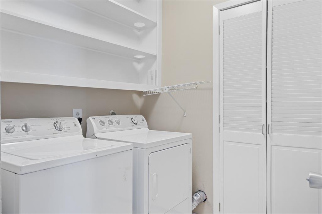 Nice laundry with built in shelving