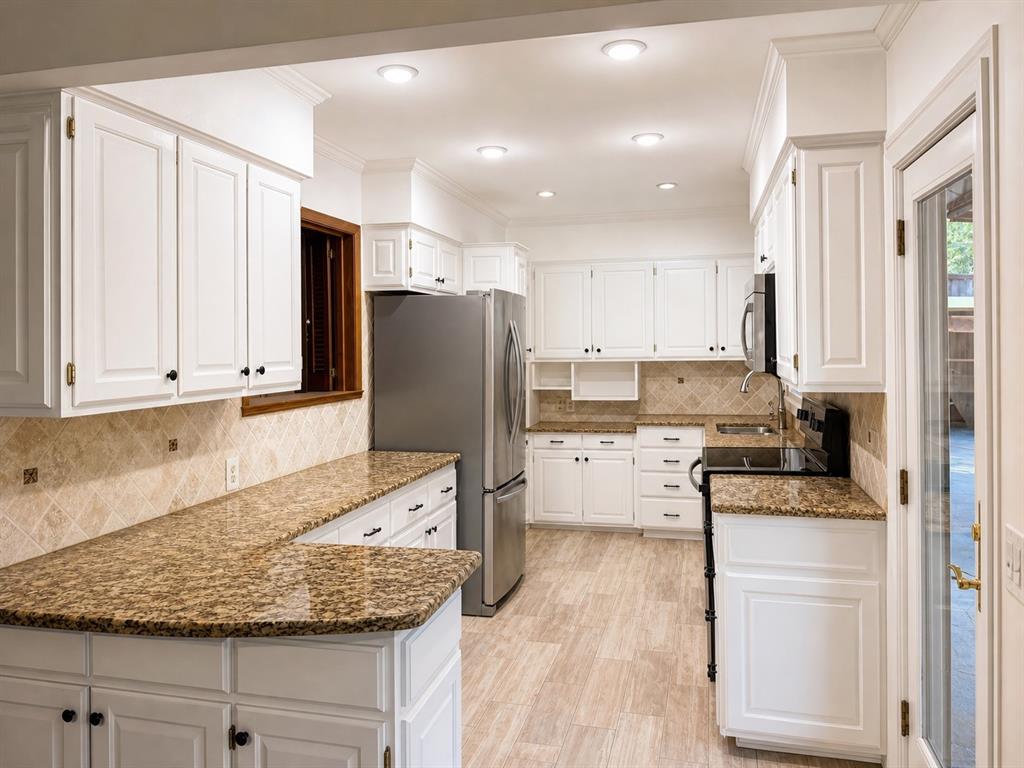Kitchen featuring white shaker-style cabinetry, stone-finish countertops, tile backsplash, wood-finish flooring, and recessed lighting