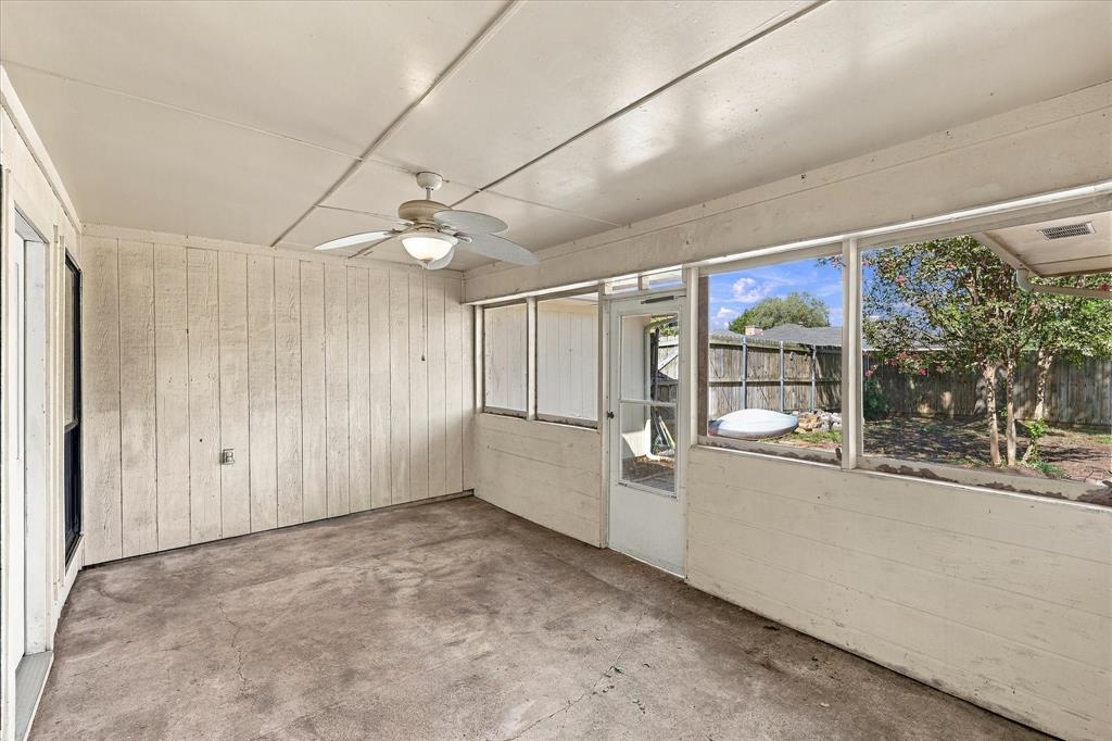 Enclosed patio out back great for enjoying family time!