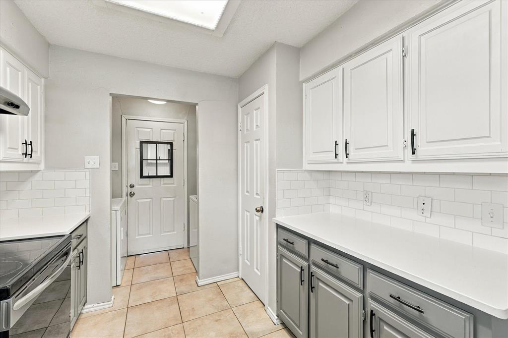 Kitchen has stainless steel appliances