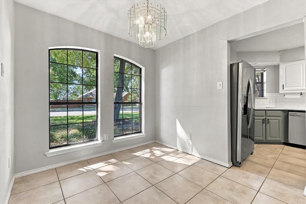 Dining room space with large window letting in natural light!