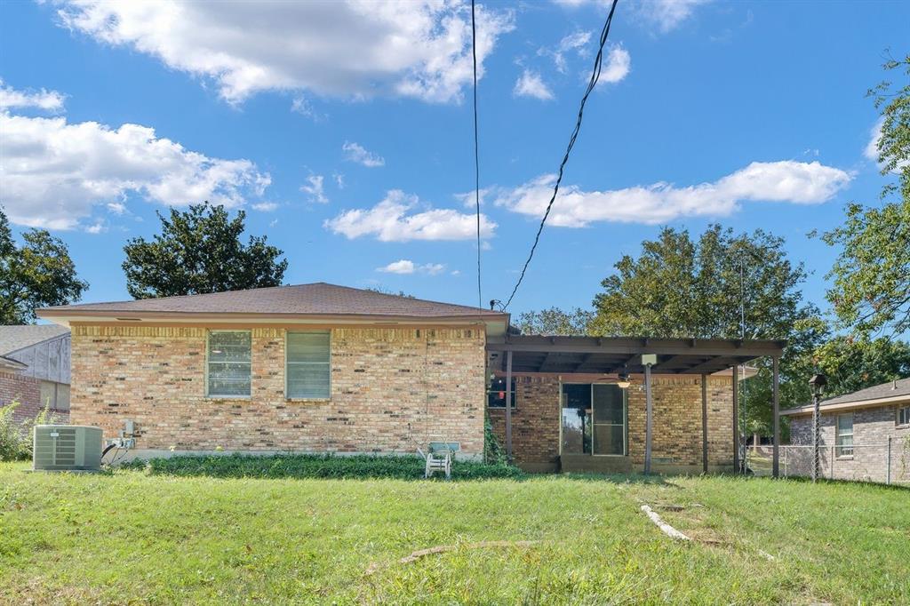 Brick exterior, hipped roof, and covered rear patio