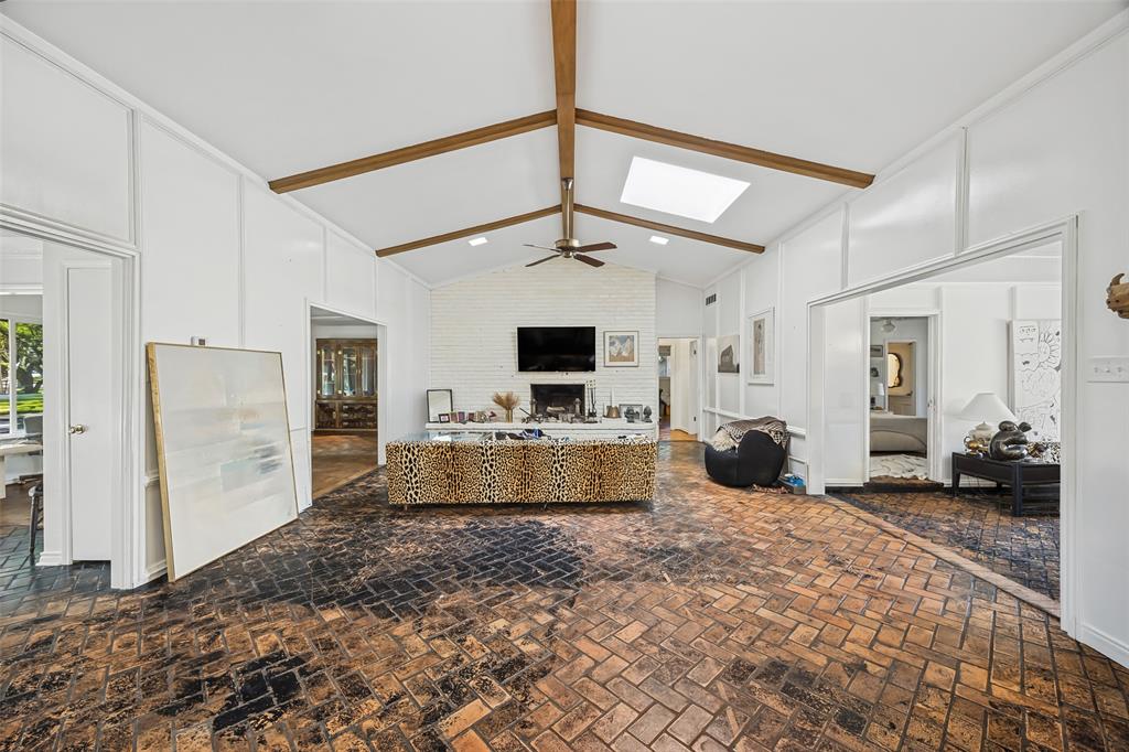View of Den with Entry and Living Room to the left and Sun Room to the right. View of Den with Entry and Living Room to the left and Sun Room to the right.