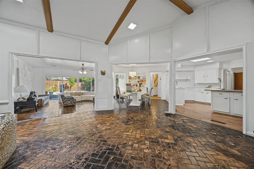 Den has fireplace, skylight, vaulted & beamed ceiling and opens to Sun Room, Kitchen, and Breakfast Room. Den has fireplace, skylight, vaulted & beamed ceiling and opens to Sun Room, Kitchen, and Breakfast Room.