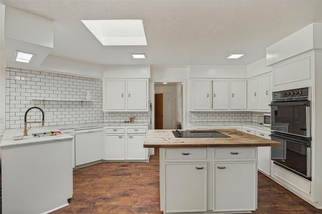 Kitchen has skylight and center island.