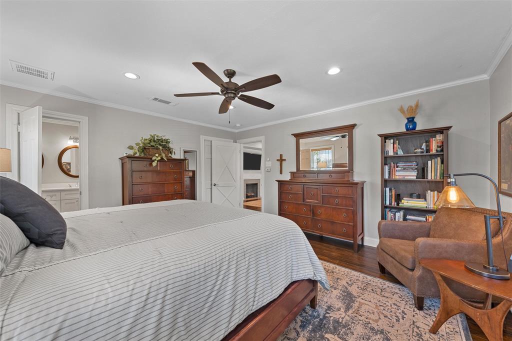 Spacious room featuring wood-finish flooring, recessed lighting, and a multi-blade ceiling fan