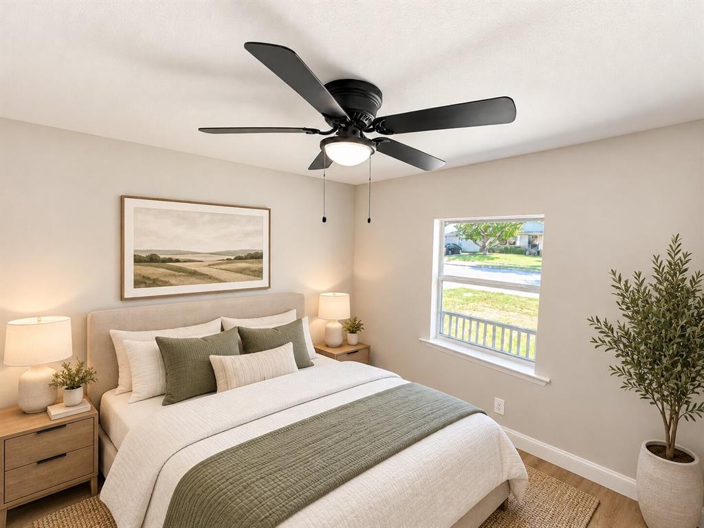 Five-blade matte black ceiling fan with central integrated lighting fixture and dual pull-chain operation