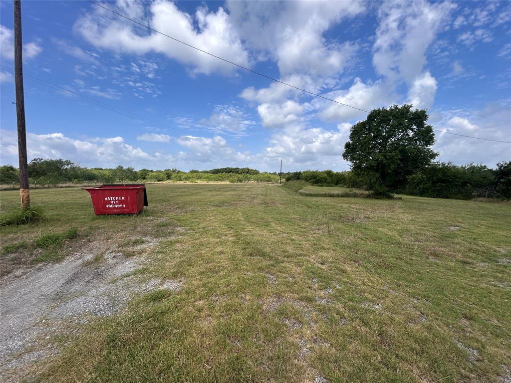 Expansive, open lot featuring level topography and mature trees