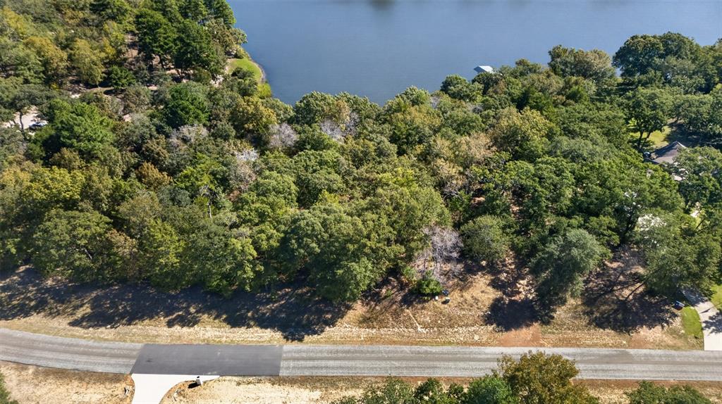Waterfront lot featuring mature tree canopy, varied topography, and direct access to the water's edge Waterfront lot featuring mature tree canopy, varied topography, and direct access to the water's edge