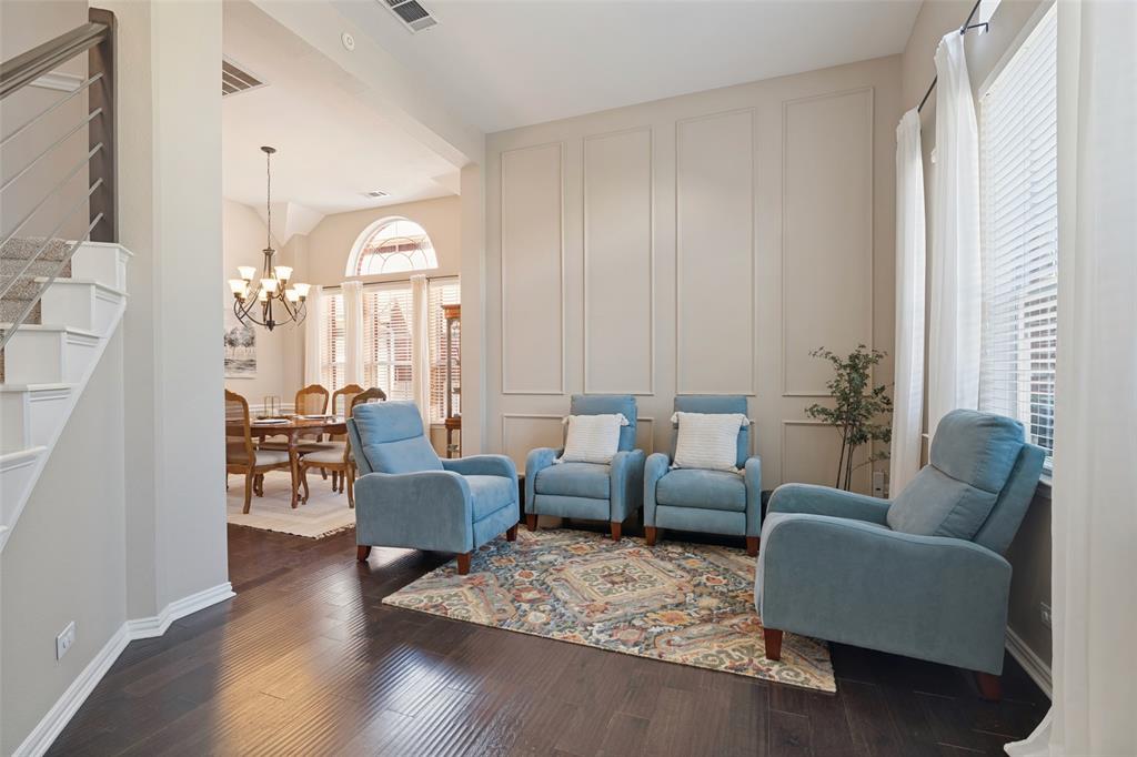 Engineered wood floors add warmth throughout the main gathering spaces