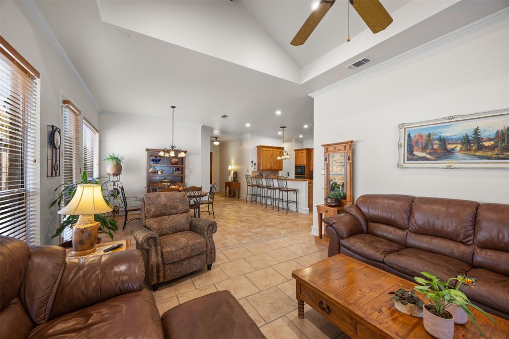 Spacious living room that overlooks the lush sideboard and backyard.