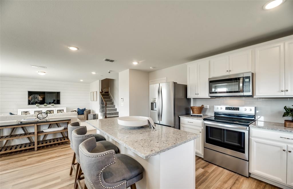 *Model Representation - Large island gathering room and dining areas overlooking