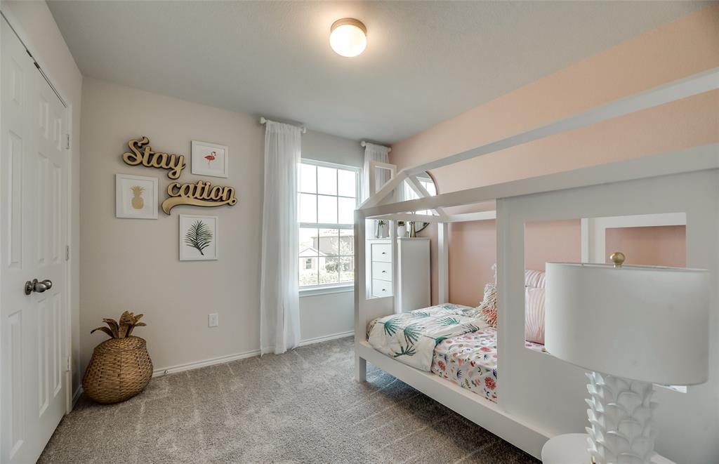 *Model Representation - Spacious secondary bedroom with large windows