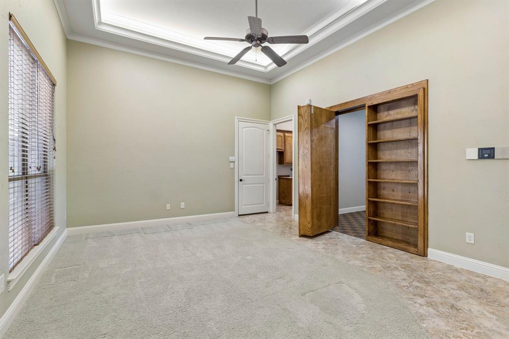 Formal living room and behind the bookcase is the perfect room for storage