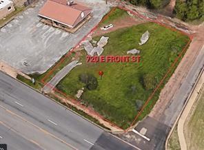 Corner lot featuring street frontage, paved access, and open terrain Corner lot featuring street frontage, paved access, and open terrain