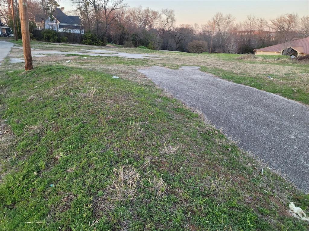 Expansive corner lot featuring paved road access and rolling topography Expansive corner lot featuring paved road access and rolling topography