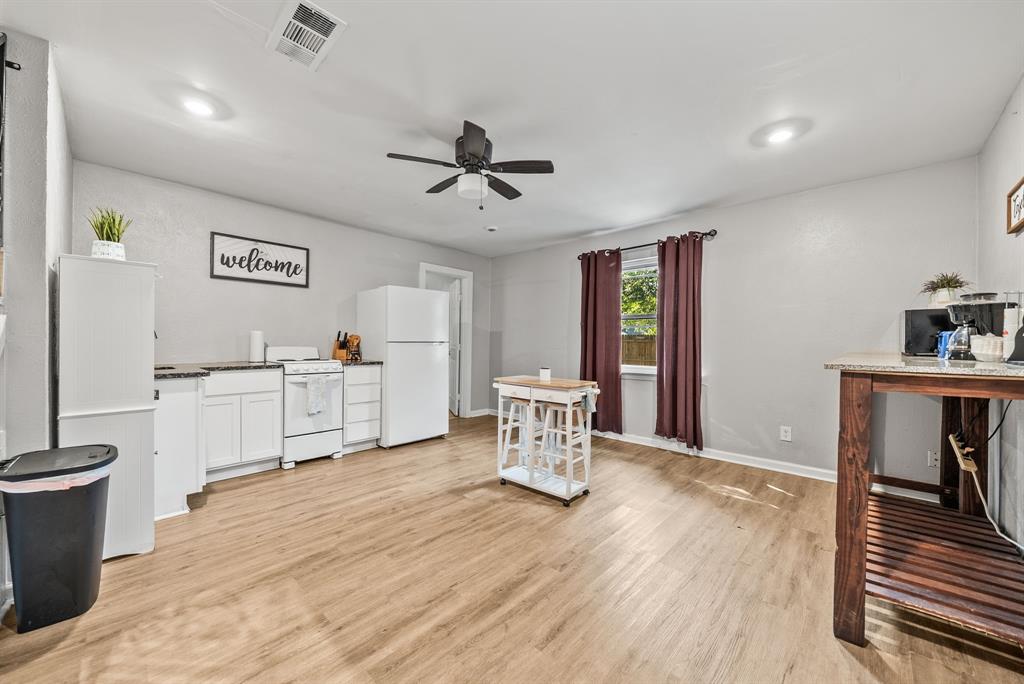 Wood-finish flooring throughout, recessed lighting, and a ceiling fan
