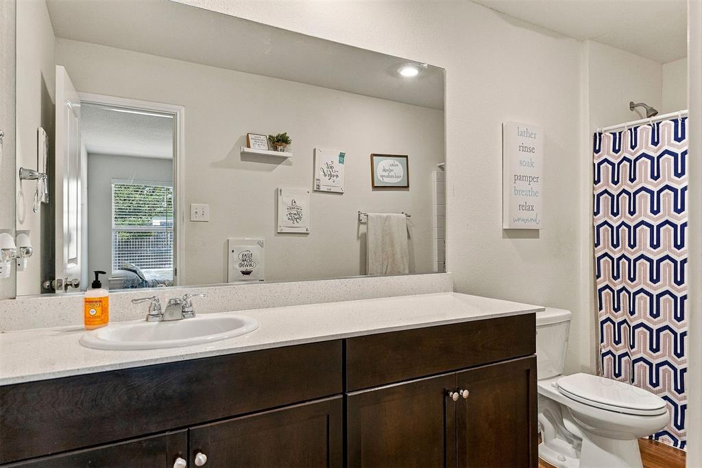 Private ensuite bathroom conveniently connected to the primary bedroom.