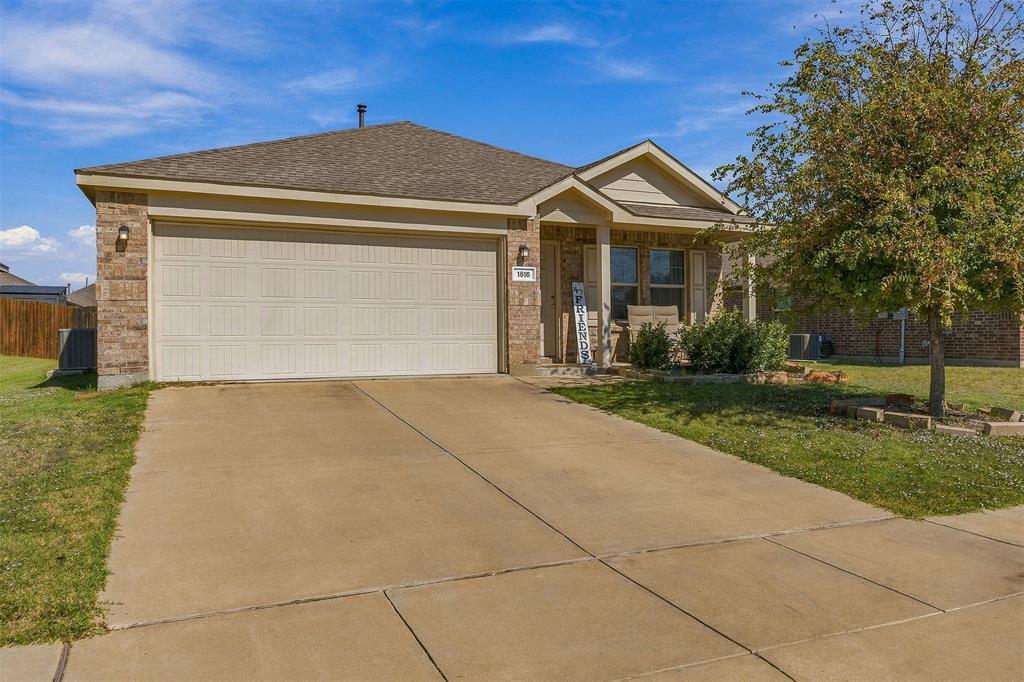 Attractive brick exterior and an attached two-car garage.